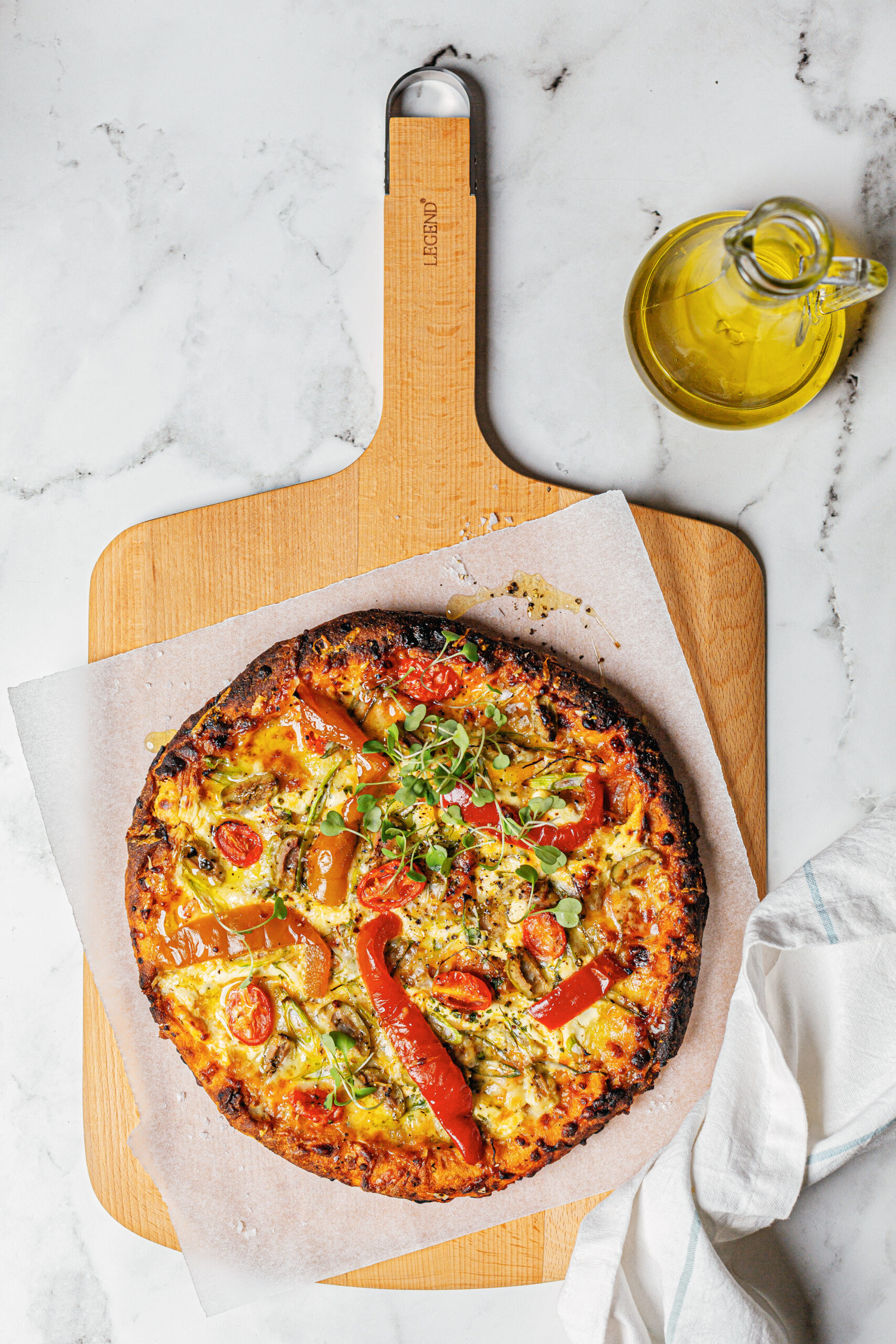 600708 6009710422939 Legend Premium Beechwood Pizza Board Lifestyle Image scaled